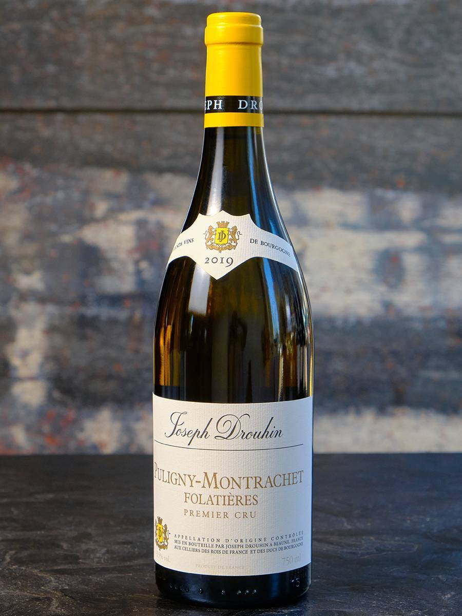 Вино Joseph Drouhin Puligny-Montrachet Premier Cru Folatieres 2019 купить в винном ресторане Остерия - лучшая цена Вино Joseph Drouhin Puligny-Montrachet Premier Cru Folatieres 2019 / Жозеф Друан Пюлиньи-Монраше Премье Крю Фолатьер