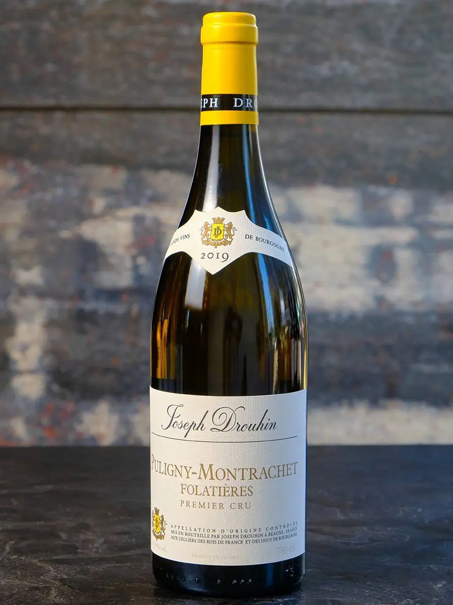 Вино Joseph Drouhin Puligny-Montrachet Premier Cru Folatieres 2019 купить в винном ресторане Остерия - лучшая цена Вино Joseph Drouhin Puligny-Montrachet Premier Cru Folatieres 2019 / Жозеф Друан Пюлиньи-Монраше Премье Крю Фолатьер